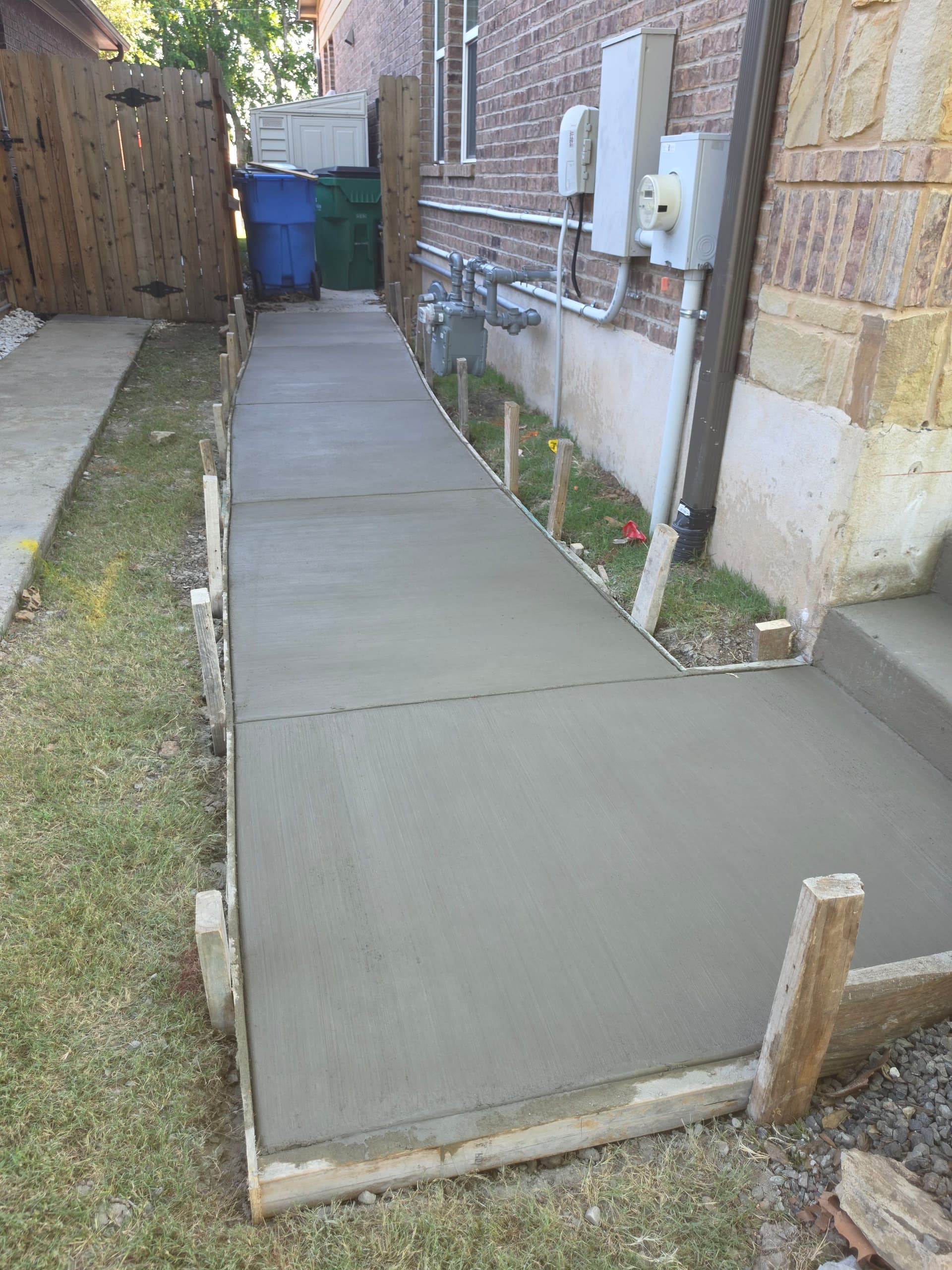 Gallery photos for New Concrete Walkway with Full Landscaping and Fence Work: Image #8