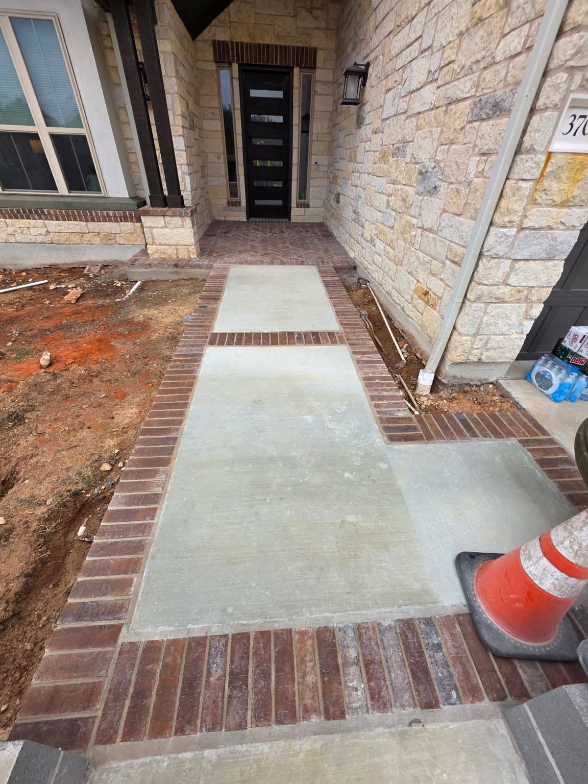 Gallery photos for Stunning Brick Porch and Concrete Sidewalk Installation: Image #1